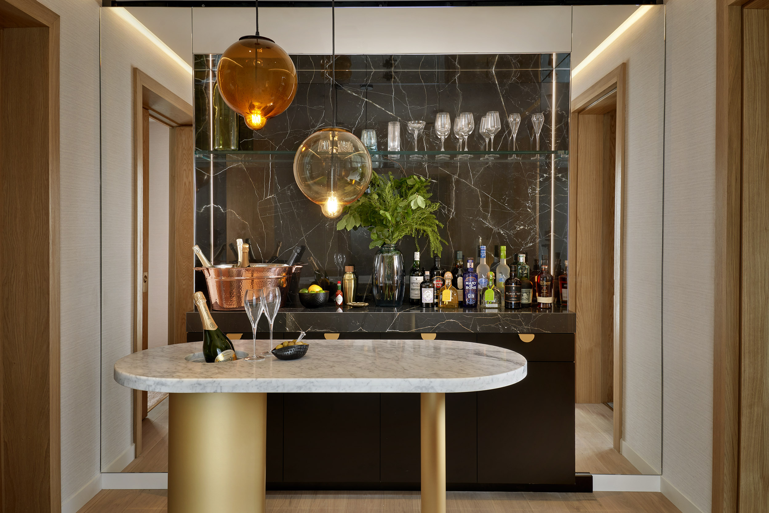 Marble bar area with champagne on the island